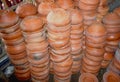 Traditional Handmade clay brown cups, pots and plates in Asian local market,Oriental bazaar. Old pottery. Exhibits ancient times Royalty Free Stock Photo