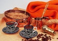 Turkish coffee set of 2 ceramig mugs with copper bowl , cooking pot and copper grinder. Royalty Free Stock Photo