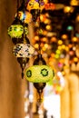 Traditional handmade multicolor Turkish, Moroccan, Arabian lamps hanging with nice blurred background. Mosaic style and colored gl