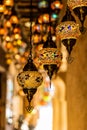 Traditional handmade multicolor Turkish, Moroccan, Arabian lamps hanging with nice blurred background. Mosaic style and colored gl
