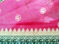 Traditional handmade white, red/pink, blue Indian silk sari /saree with golden details, woman use to wear on Onam festival, Vishu, Royalty Free Stock Photo