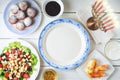 Traditional Hanukkah dishes on the white wooden table top view