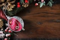 Traditional Happy Holidays and Christmas background with red and silver bauble. Royalty Free Stock Photo
