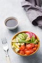 Traditional Hawaiian Poke salad with salmon, avocado rice and vegetables in a bowl Royalty Free Stock Photo