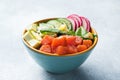 Traditional Hawaiian Poke salad with salmon, avocado rice and vegetables in a bowl Royalty Free Stock Photo