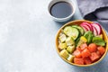 Traditional Hawaiian Poke salad with salmon, avocado rice and vegetables in a bowl. Copy space Royalty Free Stock Photo