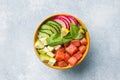 Traditional Hawaiian Poke salad with salmon, avocado rice and vegetables in a bowl. Top view Royalty Free Stock Photo