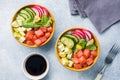 Traditional Hawaiian Poke salad with salmon, avocado rice and vegetables in a bowl on two persons. Top view Royalty Free Stock Photo