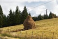 Traditional pile of hay in Romania. Royalty Free Stock Photo