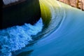 Traditional heavy water flows around a river dam