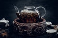 Traditional herbal tea in transparent glass teapot. Studio shot Royalty Free Stock Photo