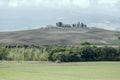 Traditional hilltop farm in Orcia valley, near Castelvecchio, Siena, Italy Royalty Free Stock Photo