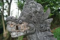 Traditional Hindu statue of dragon`s head in the garden in Bali Royalty Free Stock Photo