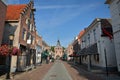 Traditional historic medieval houses along the main street Vischpoortstraat in the old picturesque fortified town of Elburg Royalty Free Stock Photo