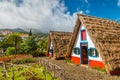 Traditional historic thatched houses with strawy roofs on Madeira island, Santana, Portugal