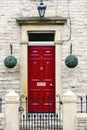 Traditional home door in England in red Royalty Free Stock Photo