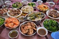 Traditional home made chinese meal. Table covered with many plates with various, delicious and colorful food. Royalty Free Stock Photo