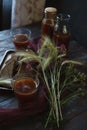 Traditional homemade beverage kvass in glasses and bottles with summer bouqute of rye and yarrow Royalty Free Stock Photo