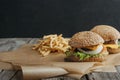 traditional homemade cheeseburgers on baking paper