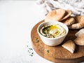 Traditional Homemade chick pea hummus, drizzled with olive oil and fresh parsley and fresh pita slices on wood cutting board. Copy Royalty Free Stock Photo