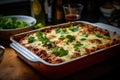 Traditional homemade italian lasagna with bolognese sauce with greens just out of the oven Royalty Free Stock Photo