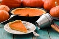 Traditional homemade pumpkin pie on white plate surrounded with Royalty Free Stock Photo