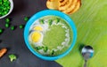Spinach, broccoli and eggs soup with cream in a bowl. Top view Royalty Free Stock Photo
