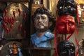 Traditional horns of fortune, Pulcinella masks and busts of Diego Maradona on San Gregorio Armeno street