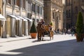 Traditional horse carts offering visitors a nostalgic city tour in Florence, Tuscany, Italy