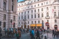 Traditional horse-drawn carriage traveling down a city street in Vienna, Austria Royalty Free Stock Photo