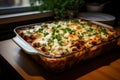 Traditional hot homemade italian lasagna with bolognese sauce and greens just out of the oven Royalty Free Stock Photo