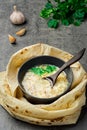 Traditional hot khash soup in a bowl, top view. Traditional Armenian, Turkish or Caucasian oriental dish - khash, with fresh