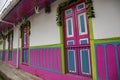 Traditional house facade with colorful painted doors and wooden panelling, Salento. Columbia