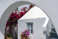 Traditional house of Santorini island with arch in front of it