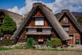 Traditional house with steeply pitched thatched roof in Shirakawa Go in Japan on a sunny day