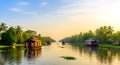 AI-generated Traditional Houseboats Gliding Through Kerala Backwaters Royalty Free Stock Photo