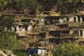 Traditional Houses on the Green Forest Rocks in Pakistani Mountains Royalty Free Stock Photo