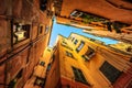 Traditional houses in a narrow street in Genoa, Italy