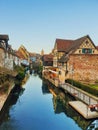Traditional houses near the river. Medieval home facade, historic town Colmar. Beautiful idyllic architecture Royalty Free Stock Photo