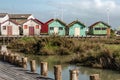 Traditional houses, old oyster huts at the edge of a canal in a village on the island of OlÃÂ©ron in France.