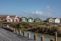 Traditional houses, old oyster huts at the edge of a canal in a village on the island of OlÃÂ©ron in France.