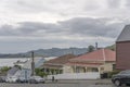 Traditional houses on steep uphill street at Lyttleton, Christchurch, New Zealand