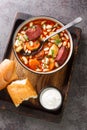 Traditional Hungarian Babgulyas bean goulash soup made of pinto beans, smoked meat, celery, carrot closeup in the plate. Vertical Royalty Free Stock Photo