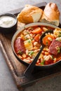 Traditional Hungarian Babgulyas bean goulash soup made of pinto beans, smoked meat, celery, carrot closeup in the plate. Vertical Royalty Free Stock Photo