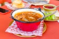 Traditional Hungarian fish soup in red kettle Royalty Free Stock Photo