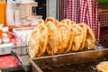 Traditional hungarian fried bread langos sold at a street vendor Royalty Free Stock Photo