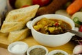 Traditional Hungarian goulash with beef, potatoes, tomatoes and peppers, a tasty dish in a white bowl Royalty Free Stock Photo