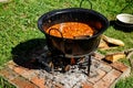 Traditional Hungarian goulash soup in the cauldron Royalty Free Stock Photo