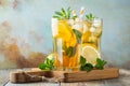 Traditional iced tea with lemon and ice in tall glasses on a wooden rustic table. With copy space Royalty Free Stock Photo