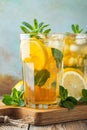 Traditional iced tea with lemon and ice in tall glasses on a wooden rustic table. With copy space Royalty Free Stock Photo